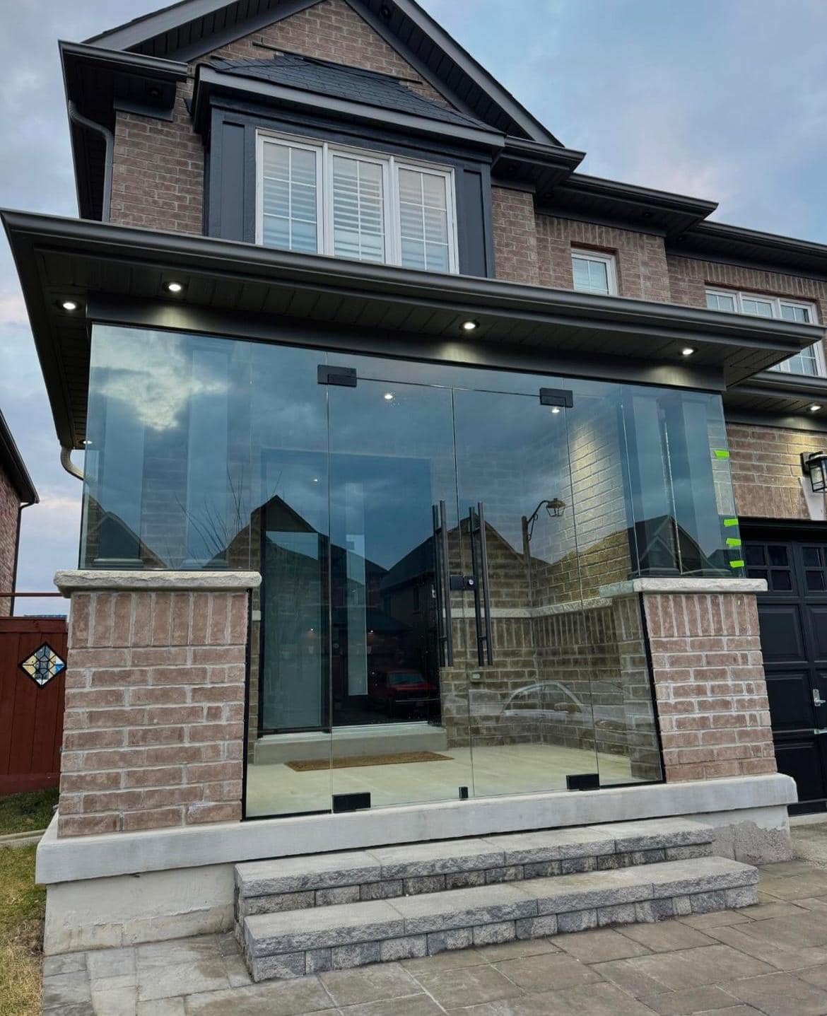 Porch with white aluminum columns in Toronto